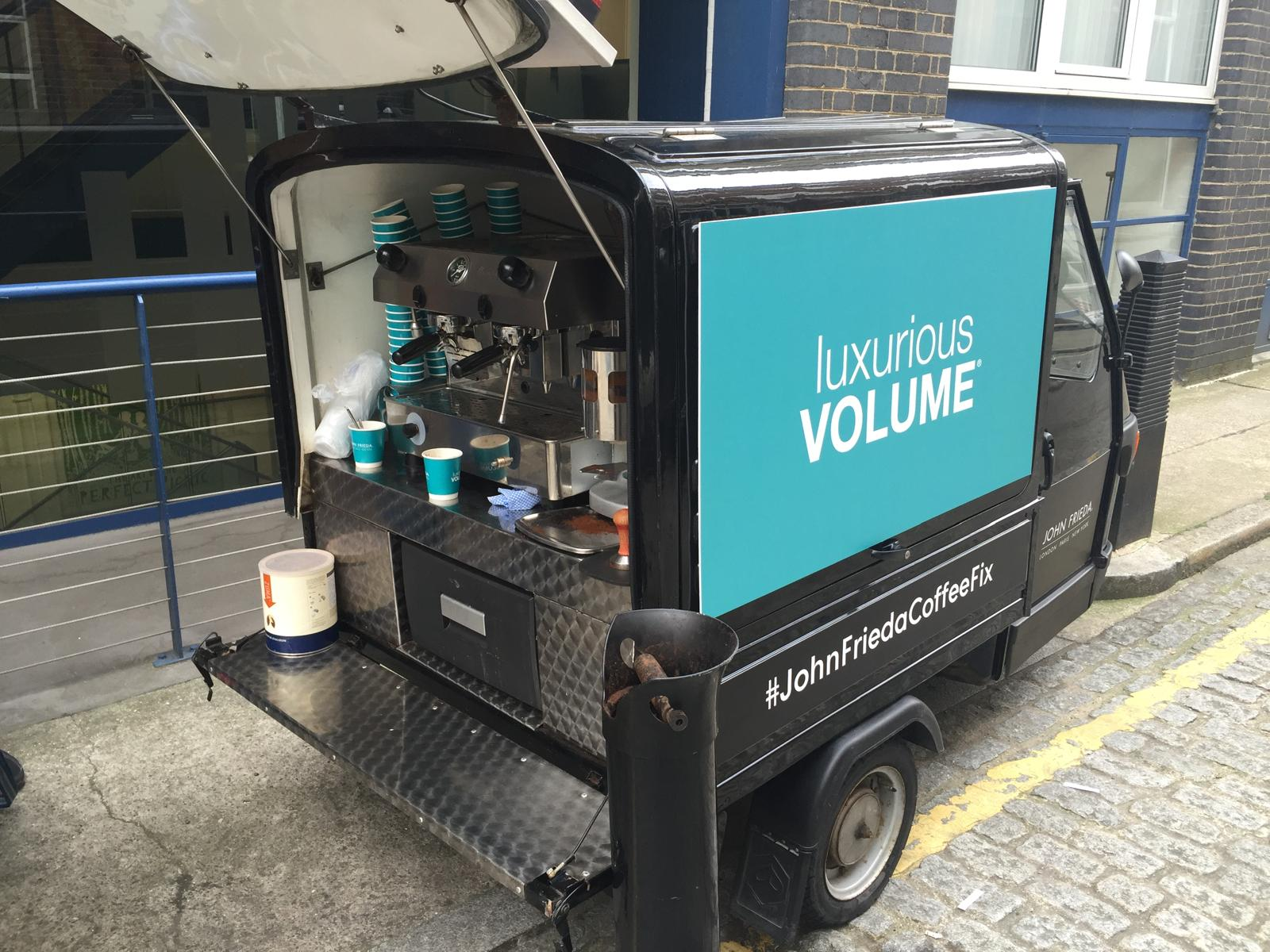 John Frieda branded motorised coffee trike with open espresso service hatch at a street activation