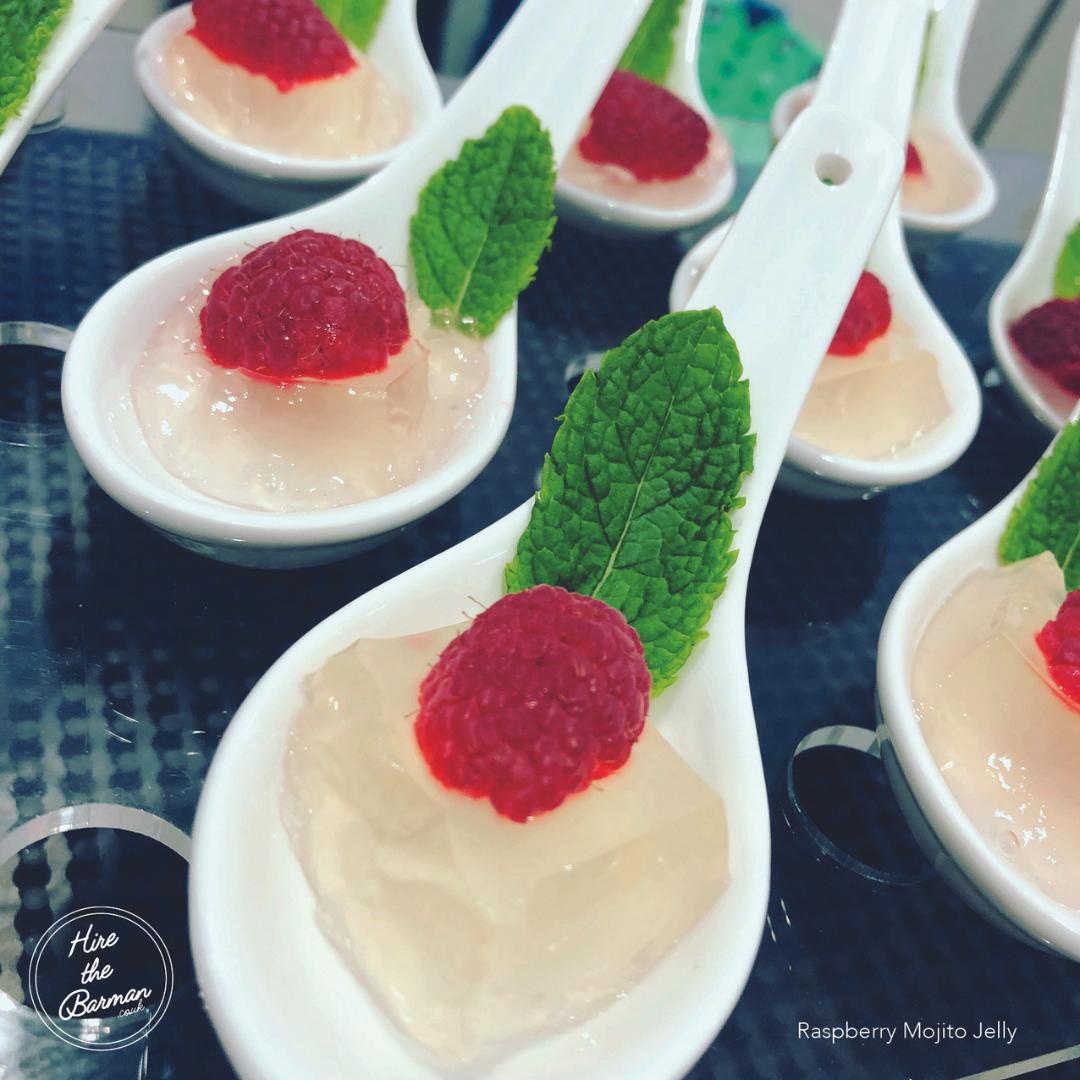Raspberry mojito jelly canapé spoons served as molecular mixology