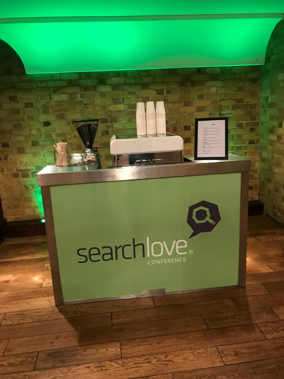SearchLove conference mobile coffee bar with espresso machine in a brick-vaulted venue